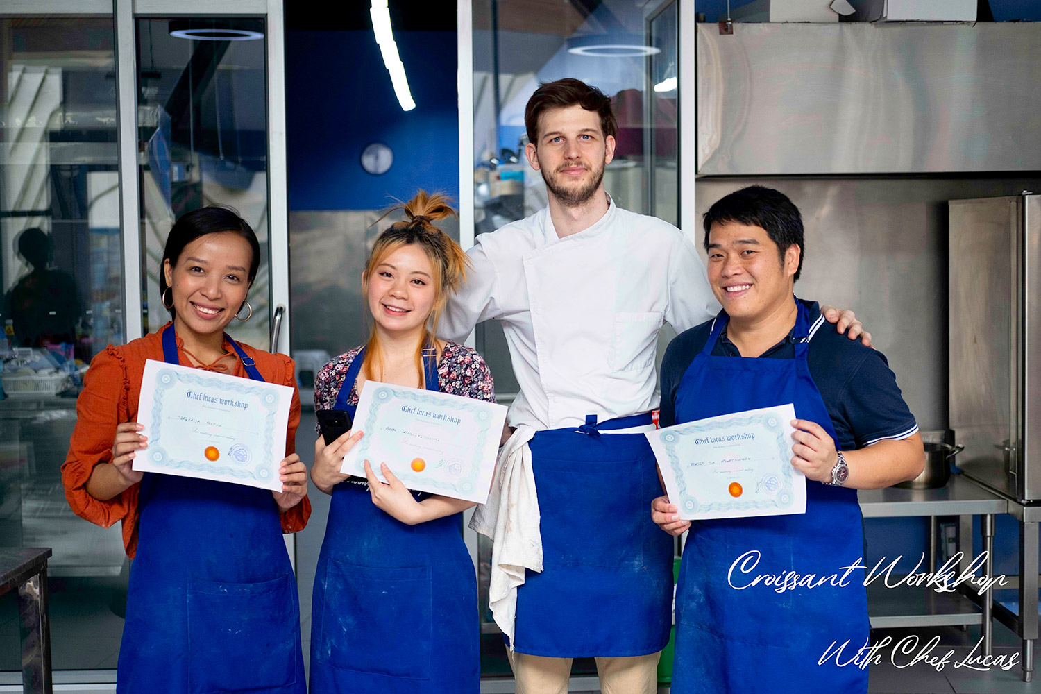 Chef Lucas with students getting their diploma