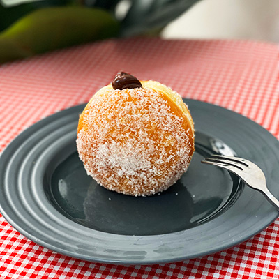 A berliner filled with chocolate ganache