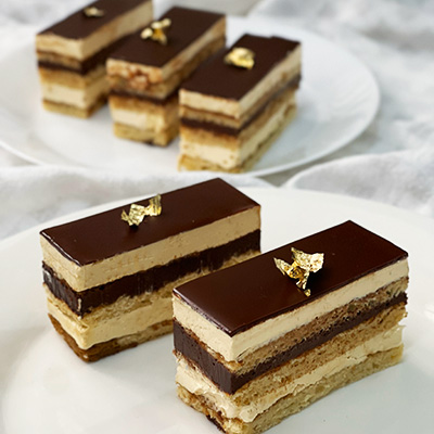 Opera cake topped with gold