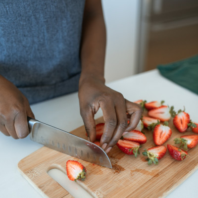 A student slicing strawberries